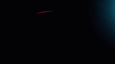 A Red Light Is Coming Out Of A Dark Background GIF