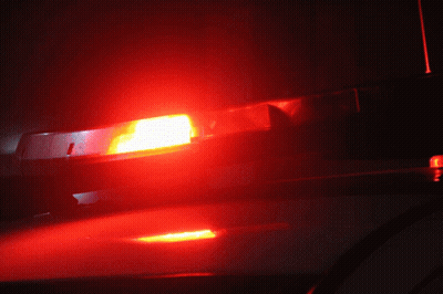 A Red Light Is Lit Up On The Roof Of A Car GIF