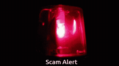 A Red Light With The Words Scam Alert Written Below It GIF