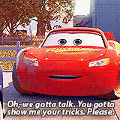 A Red Lightning Mcqueen Car Is Talking To Another Car . GIF