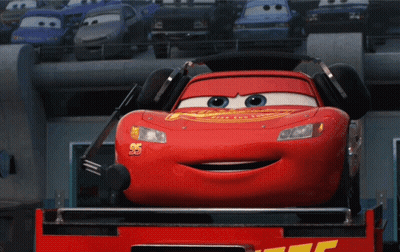 A Red Lightning Mcqueen From The Movie Cars Is Smiling GIF