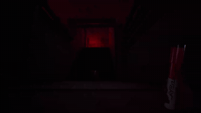 A Red Marker With The Word Sharpie On It Sits In A Dark Room GIF