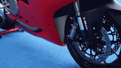 A Red Motorcycle With A Brembo Brake On It GIF