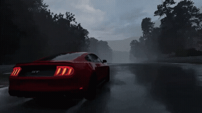 A Red Mustang Gt Is Driving On A Wet Road GIF