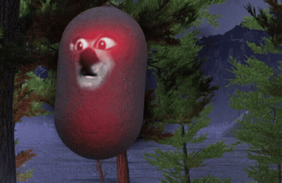 A Red Object With A Face On It Is Standing In A Forest GIF