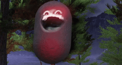 A Red Object With A Face Painted On It Is Hanging From A Tree Branch GIF