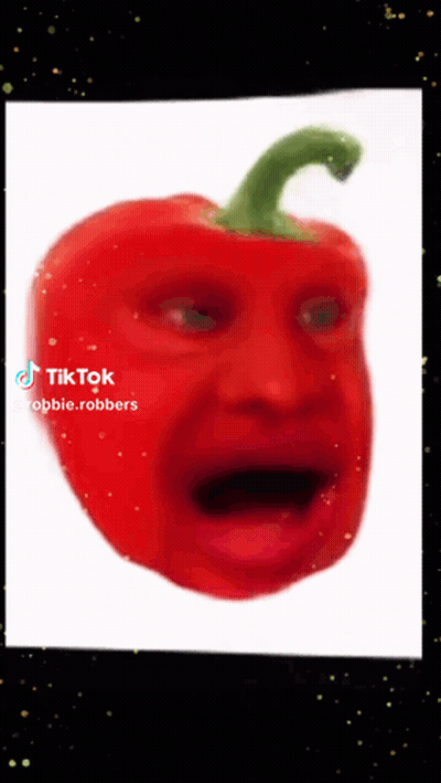 A Red Pepper With A Green Stem Looks Like A Person 'S Face GIF