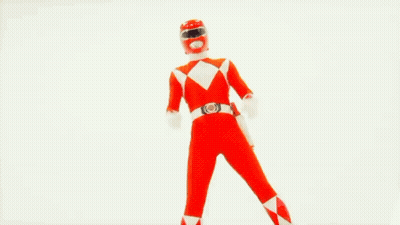 A Red Power Ranger Is Holding A Red Sword GIF