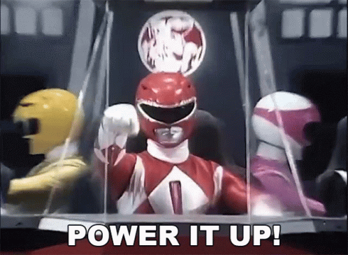 A Red Power Ranger Says Power It Up In Front Of A Yellow And Pink Power Ranger GIF