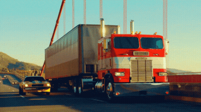 A Red Semi Truck With The Word Freightliner On The Side GIF