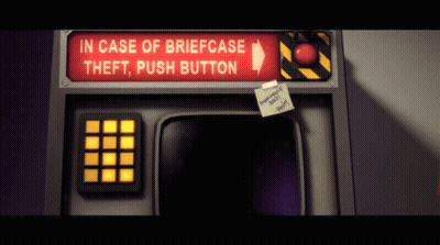 A Red Sign Says In Case Of Briefcase Theft Push Button On It GIF