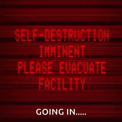 A Red Sign Says Self-Destruction Imminent Please Evacuate Facility Going In GIF