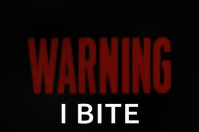 A Red Sign That Says Warning I Bite On It GIF
