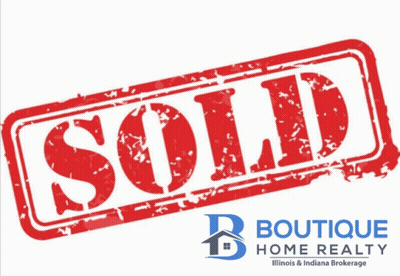 A Red Sold Stamp From Boutique Home Realty Illinois GIF