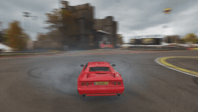 A Red Sports Car With A License Plate That Says ' A ' On It Is Driving Down A Road GIF
