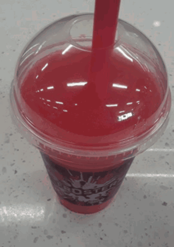 A Red Star Cup With A Red Straw In It GIF
