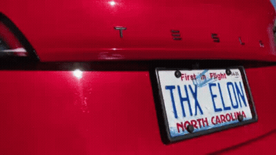 A Red Tesla Has A North Carolina License Plate GIF