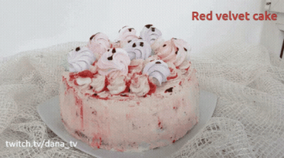 A Red Velvet Cake Is Sitting On A Table GIF