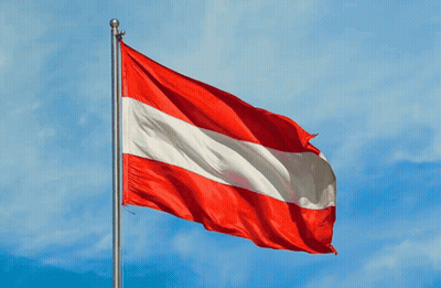 A Red White And Blue Flag With A Blue Sky In The Background GIF