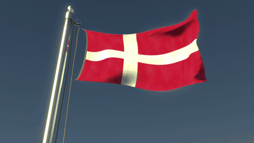 A Red White And Blue Flag With A Cross On It GIF