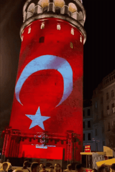 A Red White And Blue Tower With A Star And Crescent Moon On It GIF
