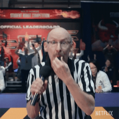 A Referee In A Striped Shirt Is Holding A Microphone And Eating A Snack . GIF