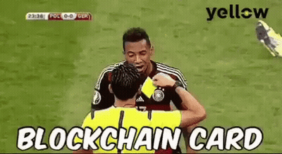 A Referee Is Giving A Yellow Card To A Soccer Player On The Field . GIF