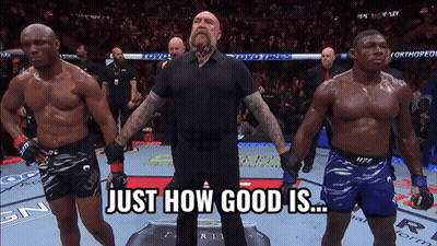 A Referee Stands Between Two Fighters With The Words Just How Good Is Behind Him GIF