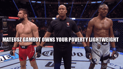 A Referee Stands Between Two Fighters With The Words Mateusz Gamrot Owns Your Poverty Lightweight Above Them GIF