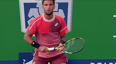 A Referee Stands In Front Of An Ad For Morgan GIF