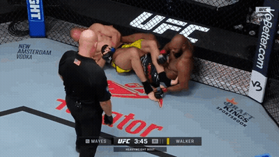 A Referee Watches A Heavyweight Bout Between Mayes And Walker At 3:45 GIF
