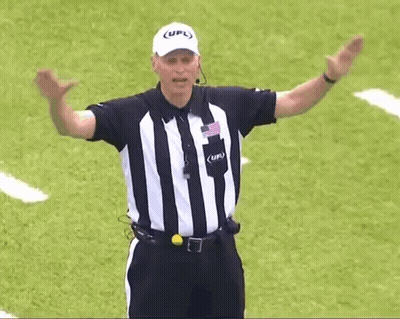 A Referee Wearing A Striped Shirt And A White Hat With The Word Ufl On It GIF