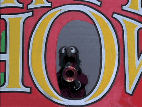 A Reflection Of A Person Playing A Trumpet In A Sign That Says Hot GIF