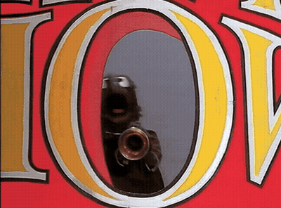 A Reflection Of A Person Taking A Picture With A Camera In The Letter O GIF