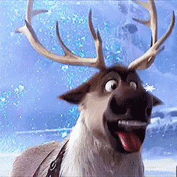 A Reindeer With Antlers Sticking Its Tongue Out . GIF