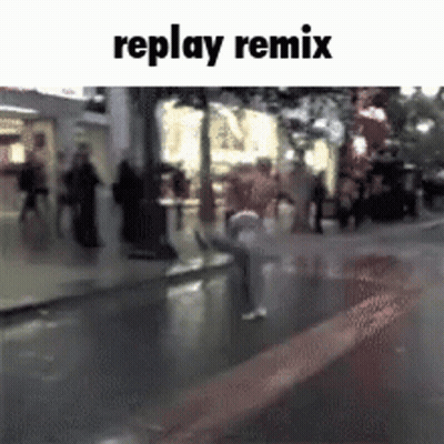 A Replay Remix Video Of A Person Sitting On A Sidewalk In The Rain GIF