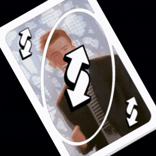 A Reverse Uno Card With A Man In A Suit And Tie GIF