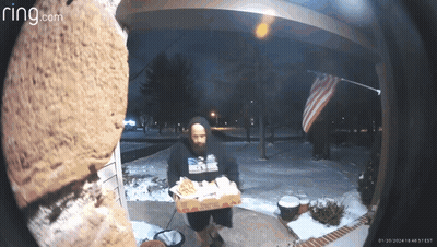 A Ring Camera Shows A Man Carrying A Box Of Domino 'S Pizza GIF