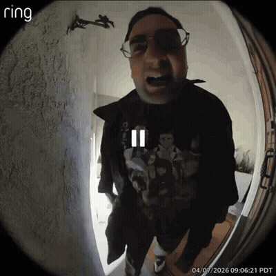 A Ring Doorbell Shows A Man Wearing Glasses And A Black Jacket GIF