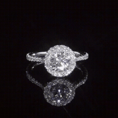 A Ring With A Round Diamond In The Center GIF