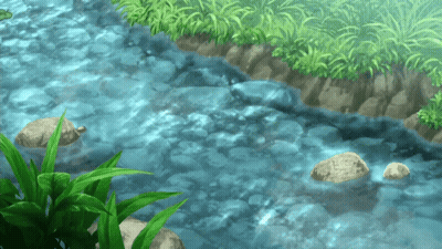 A River Flowing Through A Grassy Area With Rocks In The Water GIF