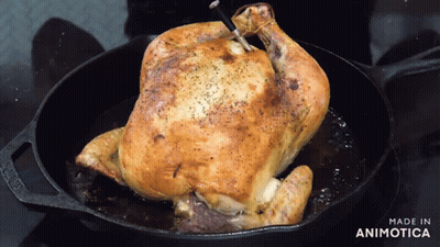 A Roasted Chicken Is Being Cooked In A Cast Iron Skillet With The Words Made In Animotica Below It GIF