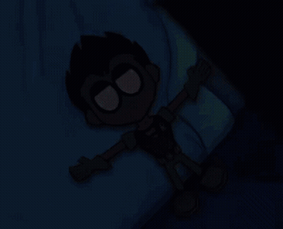 A Robin Cartoon Character Is Laying On A Bed With His Arms Outstretched GIF