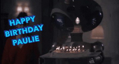 A Robot Holding A Birthday Cake With The Words Happy Birthday Paulie Written In Blue GIF