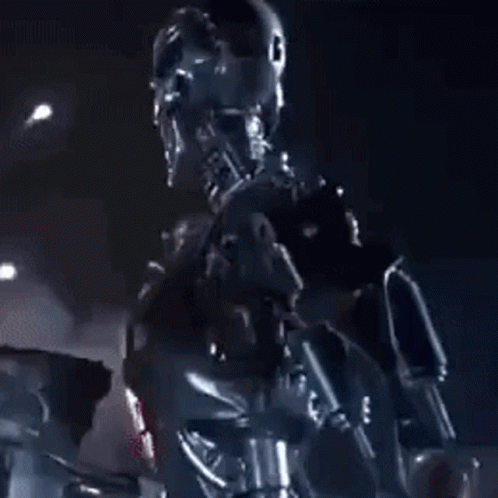 A Robot Is Holding A Gun In A Dark Room With A Purple Light Behind It . GIF
