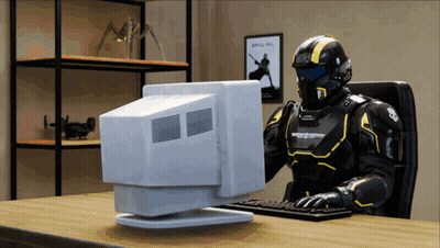 A Robot Is Sitting At A Desk Using A Computer With A Poster On The Wall That Says Spill On GIF