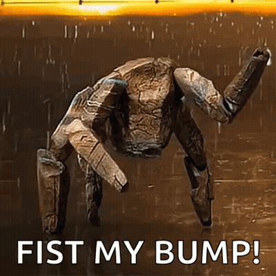 A Robot Is Standing In The Rain With The Words `` Fist My Bump '' Written On The Bottom . GIF