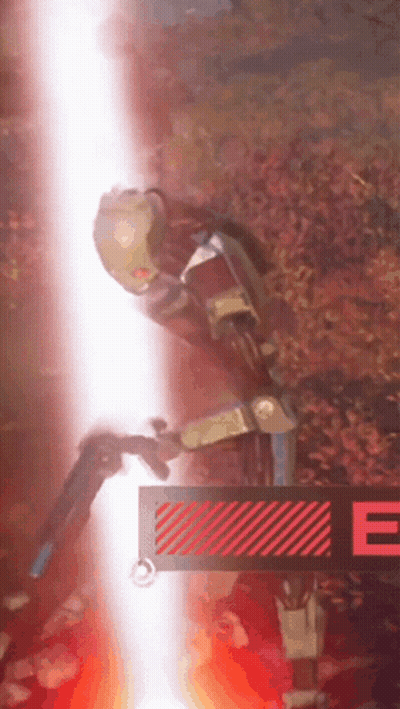A Robot Is Standing Next To A Sign That Says E GIF