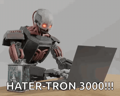 A Robot Is Typing On A Laptop Next To A Can Of Oil GIF