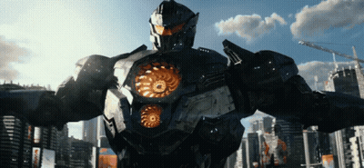 A Robot Stands In Front Of A City With A Blue Sky And Clouds GIF